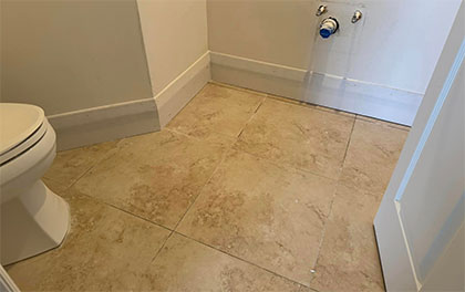 Installed white front door with glass insert.