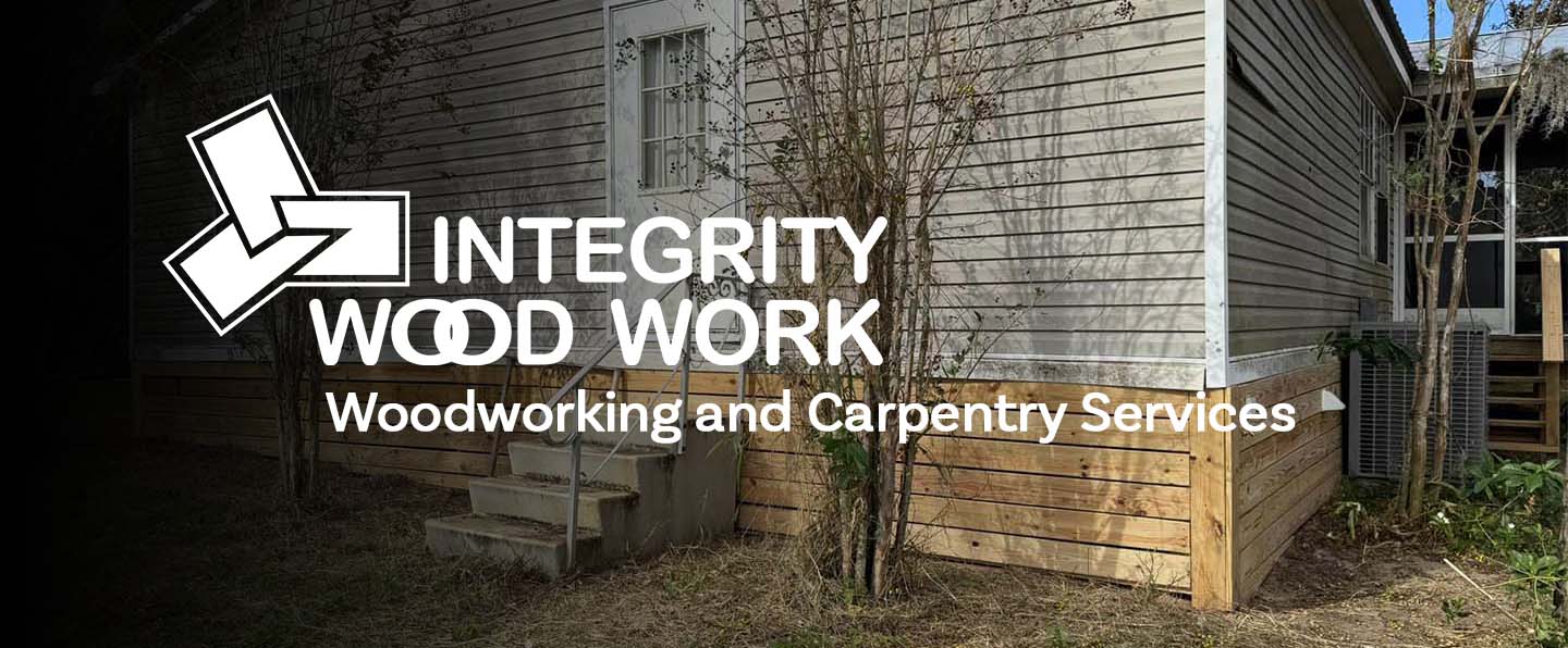 hero image for integrity woodwork. The integrity wood work logo superimposes over a single wide trailer home with brand new wood skirting. past the cornerr of the house