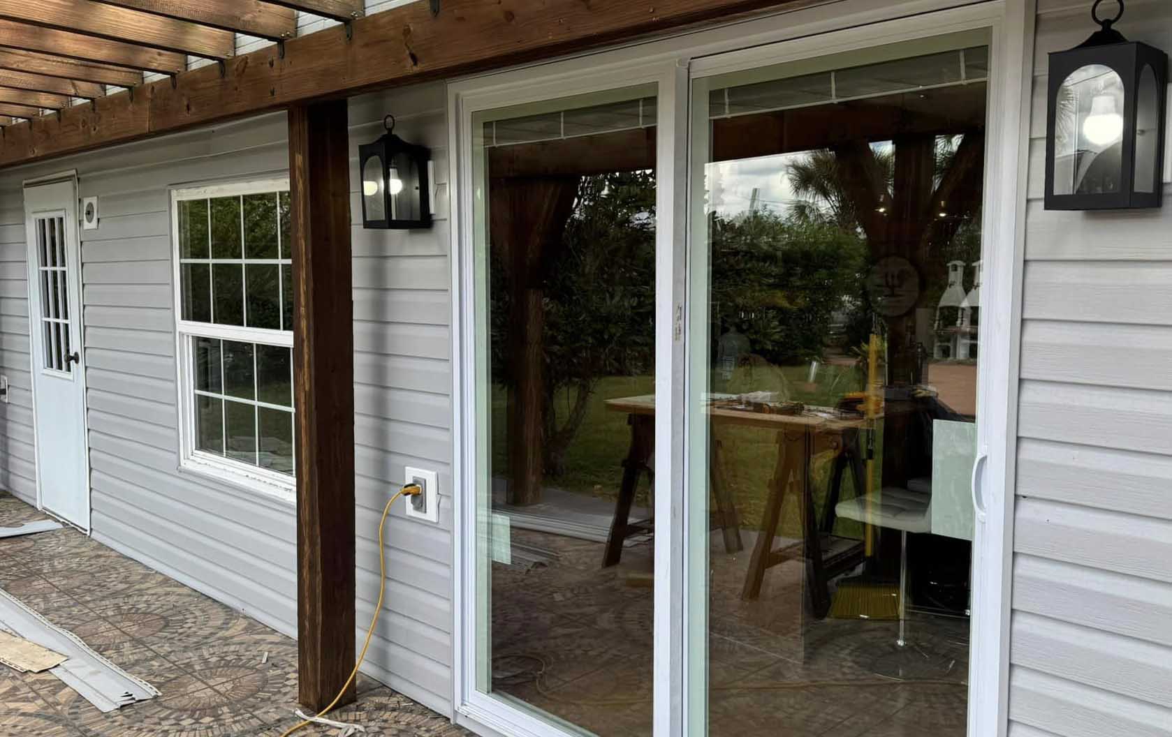 image shows newly installed sliding doors, window and door.